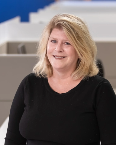smiling person in professional attire